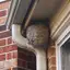 Wasp nest under roof eaves, a common sign of a wasp problem in {city}, {state}